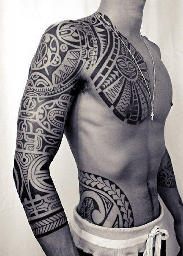 traditional polynesian tattoo tiki mask pectoral tattoo